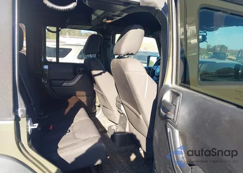 2015 Jeep Wrangler Unlimited Willys Wheeler из США, поврежденный, VIN 1C4BJWDG8FL569380